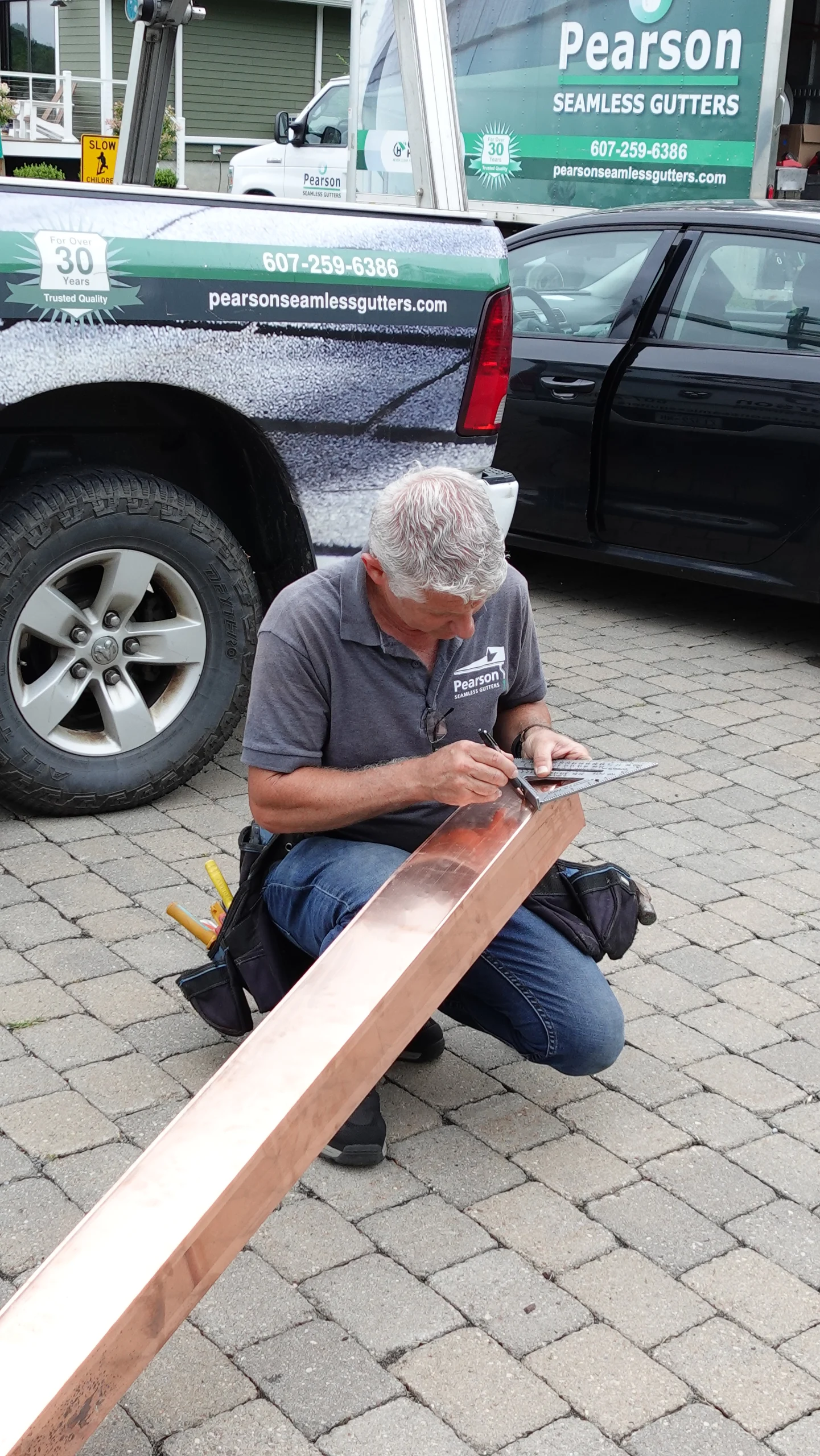 Luke Pearson, the owner of Pearson Seamless Gutters, working on a copper gutter installation. Luke Pearson, the owner of Pearson Seamless Gutters, working on a copper gutter installation.